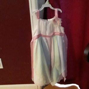 White spring dress with a pink satin ribbon